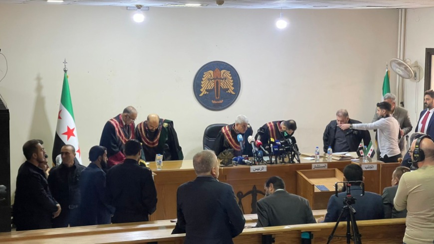 Fourteen defendants stood before the bench, including former regime loyalists and current personnel from the Ministry of Defence.